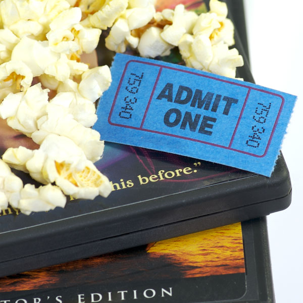 dvd movie boxes with popcorn and movie ticket