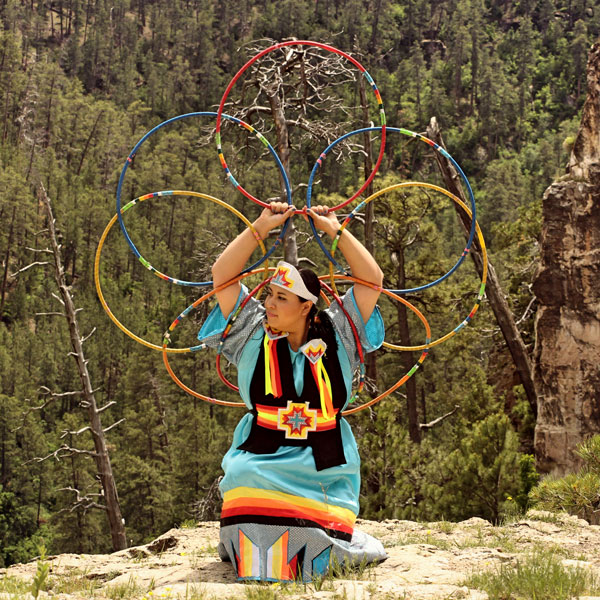 young native american woman in hoop dance