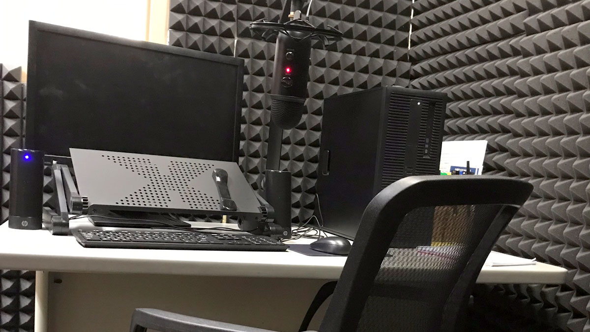 recording studio in rapid city featuring desk, sound proof walls, computer and microphone