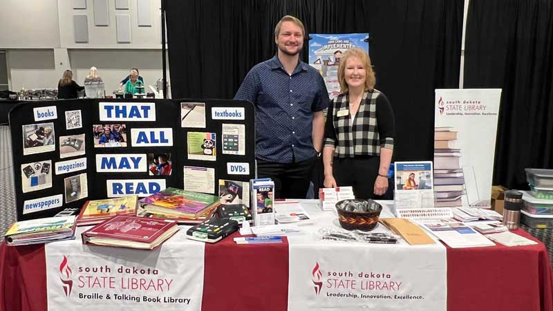 josh and brenda at sdsl vendor table