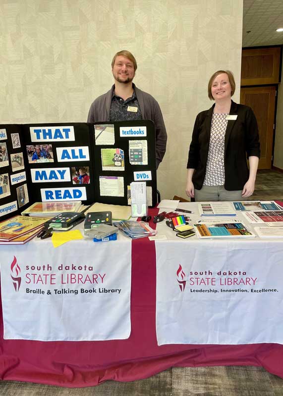 Josh and kim staff from SDSL at vendor table