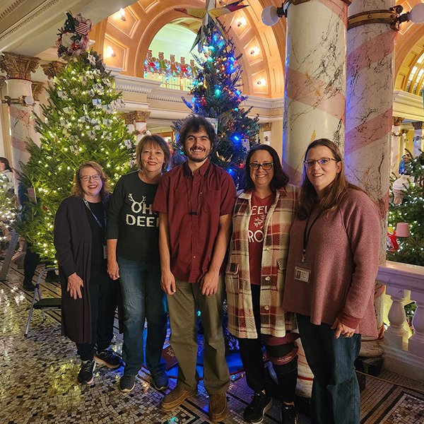 accessible library services staff at christmas tree display in capital building in pierre