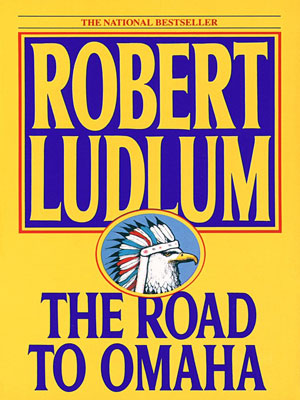 book cover features The Road to Omaha by Robert Ludlum
