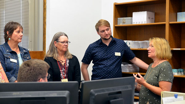 north dakota staff talking with south dakota staff