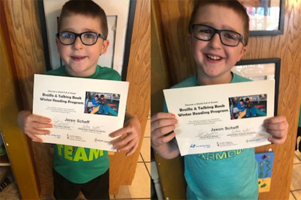 photos of two young smiling boys holding certificates