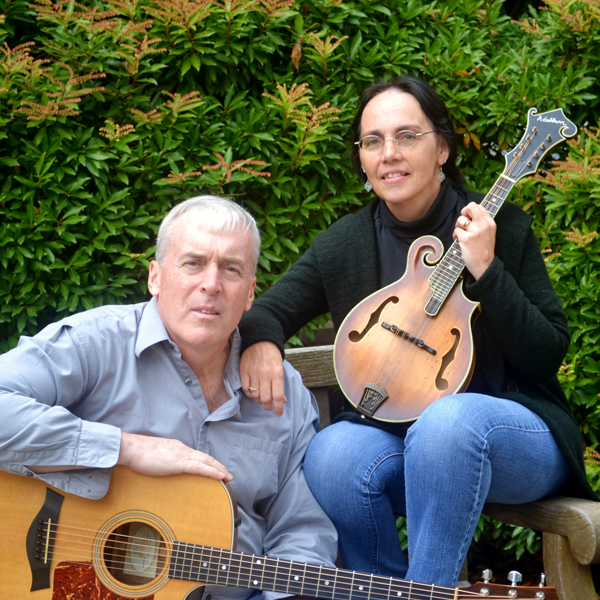 man and woman playing guitars