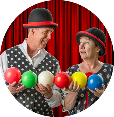 man and woman juggling hats