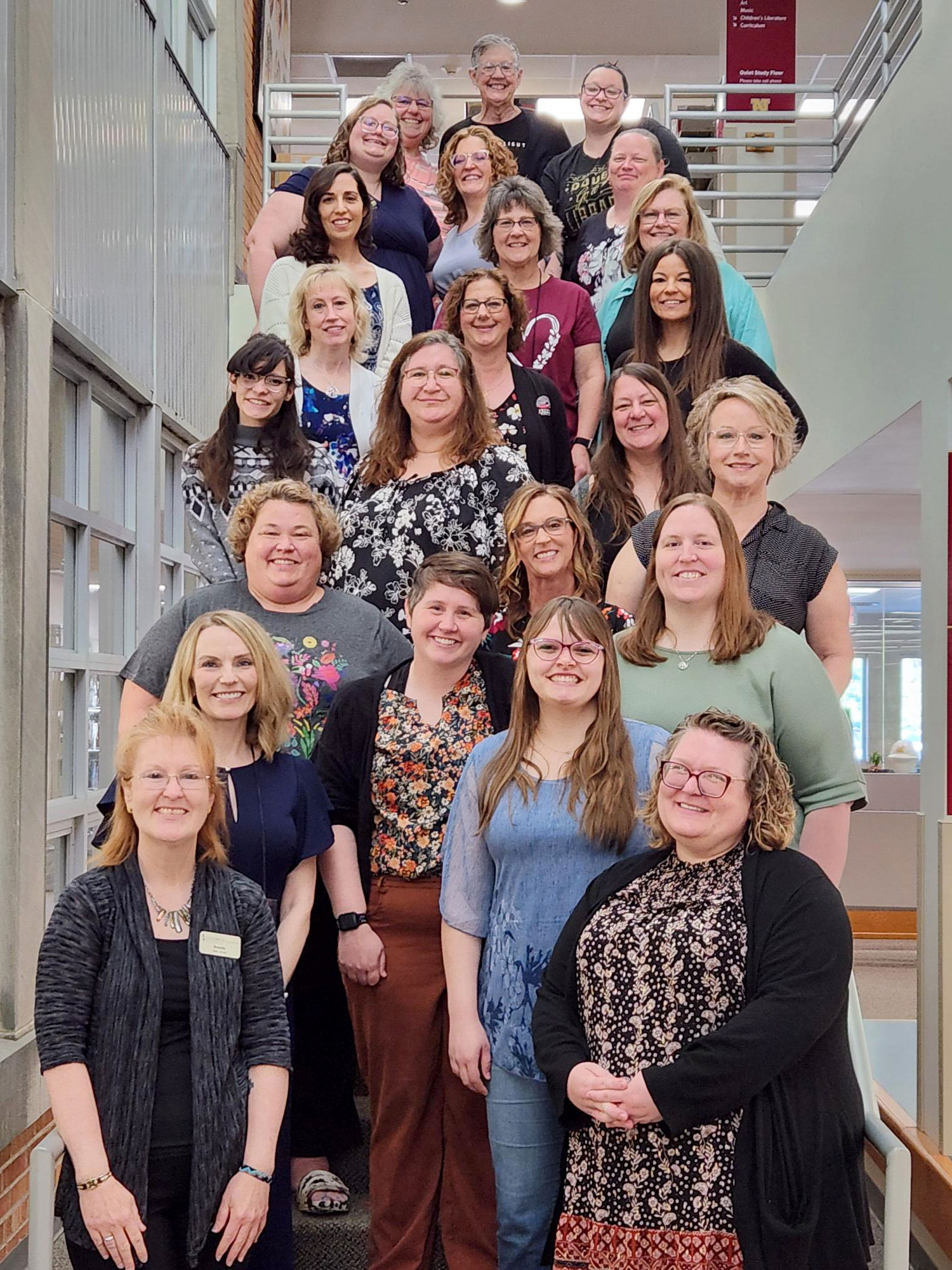 group of adults standing on stairs, annual Institute photo of students