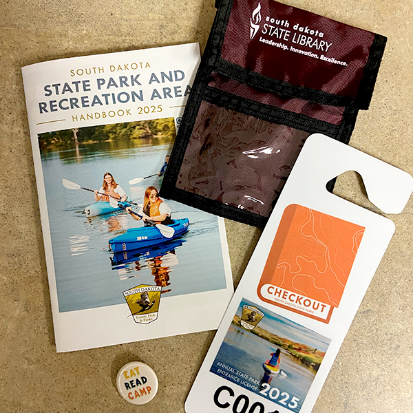 packet of south dakota state park and recreation area, 2025 park pass, check out, and south dakota state library neck wallet